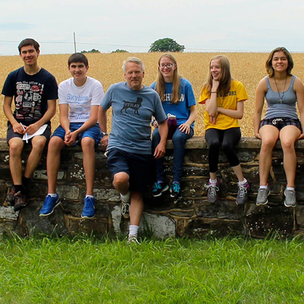 Teenagers sitting on a wall